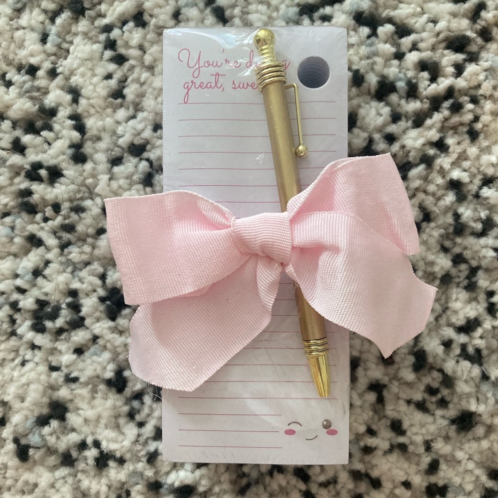 Notepad and gold pen